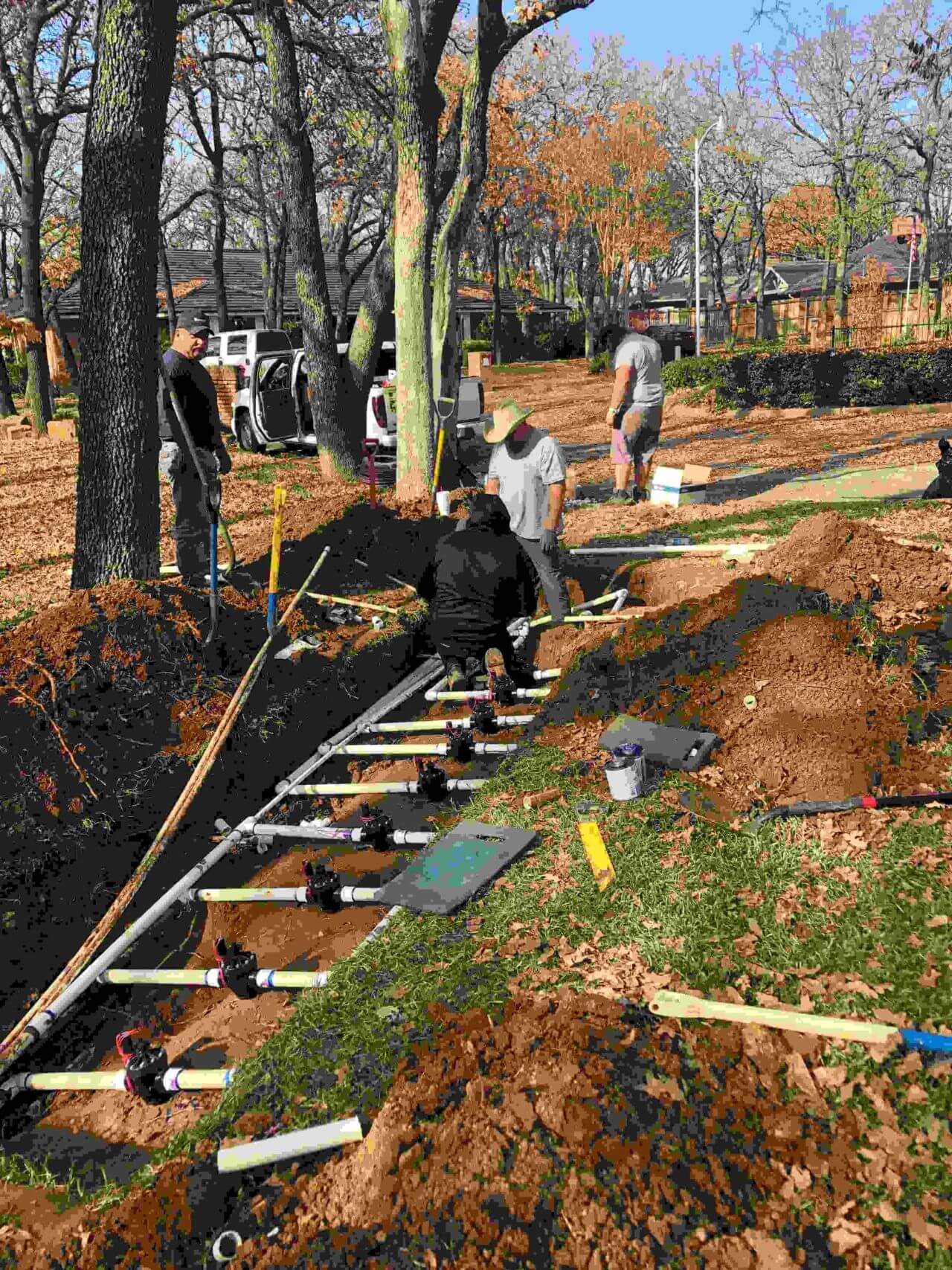 A group of people working on a railroad track.